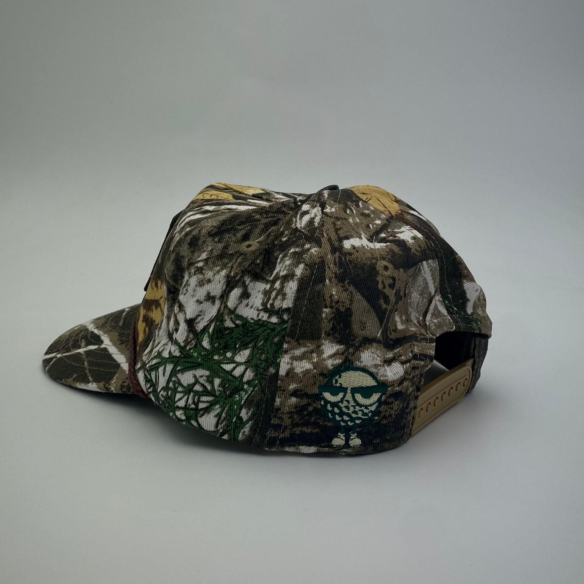 LOOPER CO. Patch Cap V1 Bushland Camo side profile showing brim rope detail — adjustable golf streetwear cap
