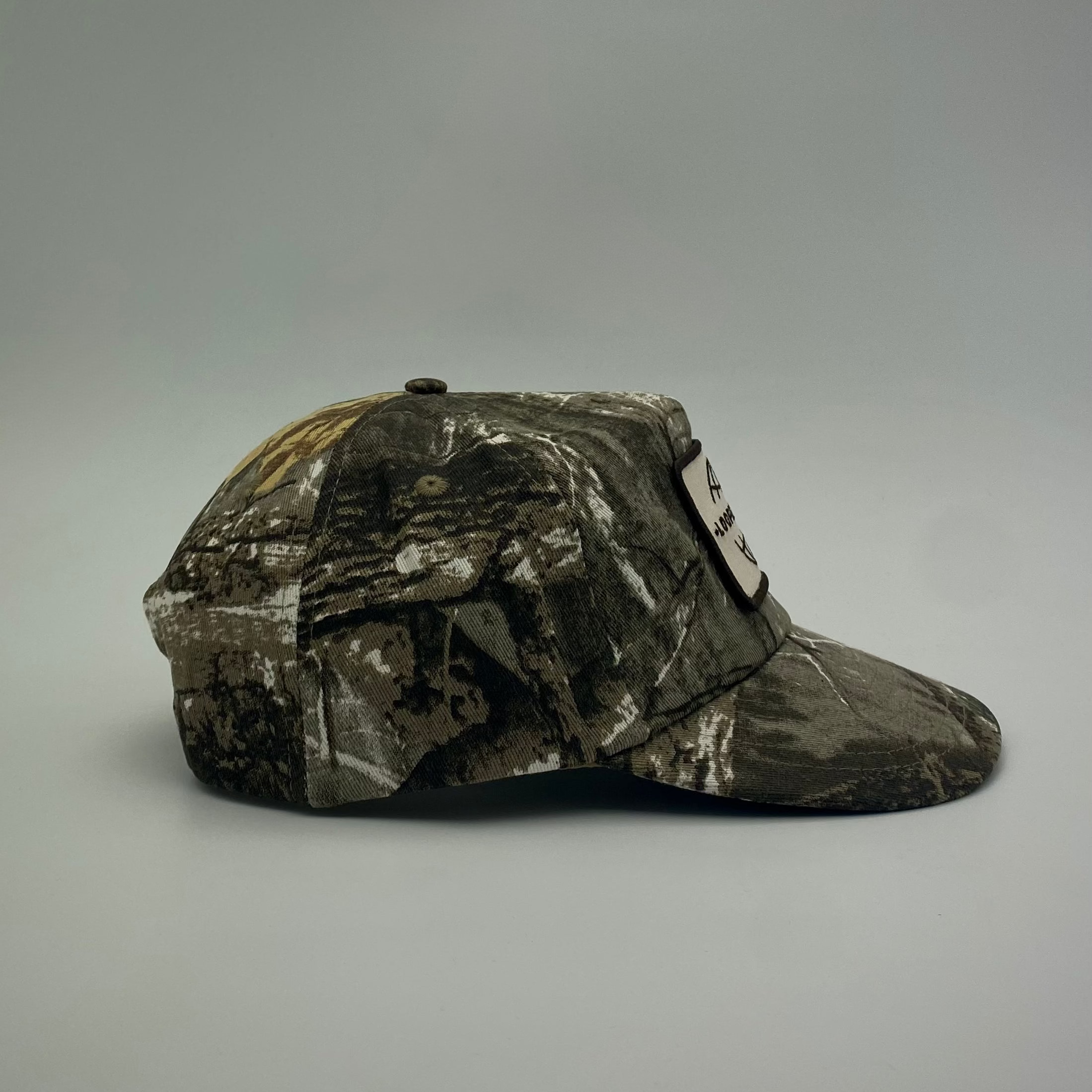 LOOPER Patch Cap V1 Bushland Camo no rope lifestyle — unique foliage camo pattern, snap strap fit