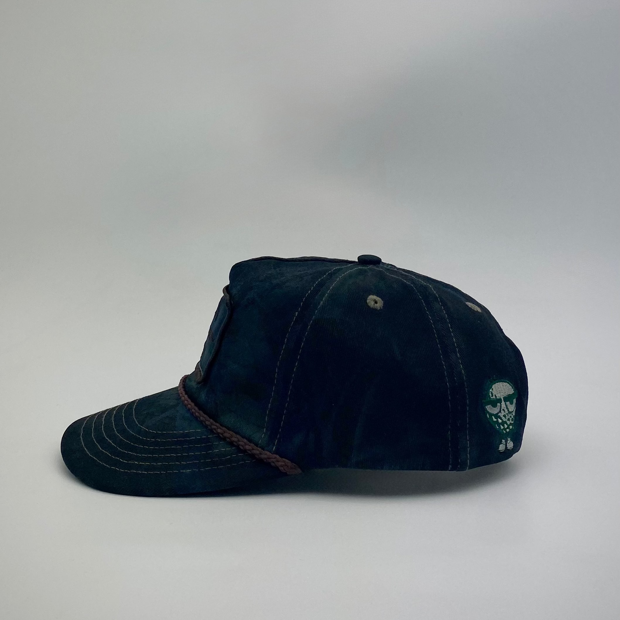 LOOPER CO. Patch Cap V2 Nightfall Camo side profile with brim rope — black, navy and forest green foliage pattern