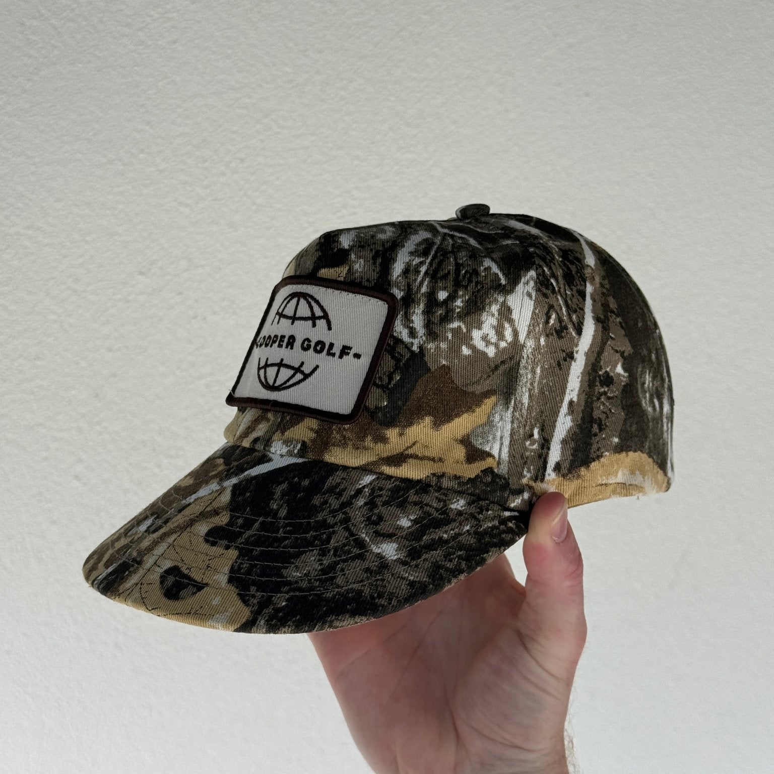 LOOPER CO. Patch Cap V1 Bushland Camo No Rope — stitched patch logo detail close up
